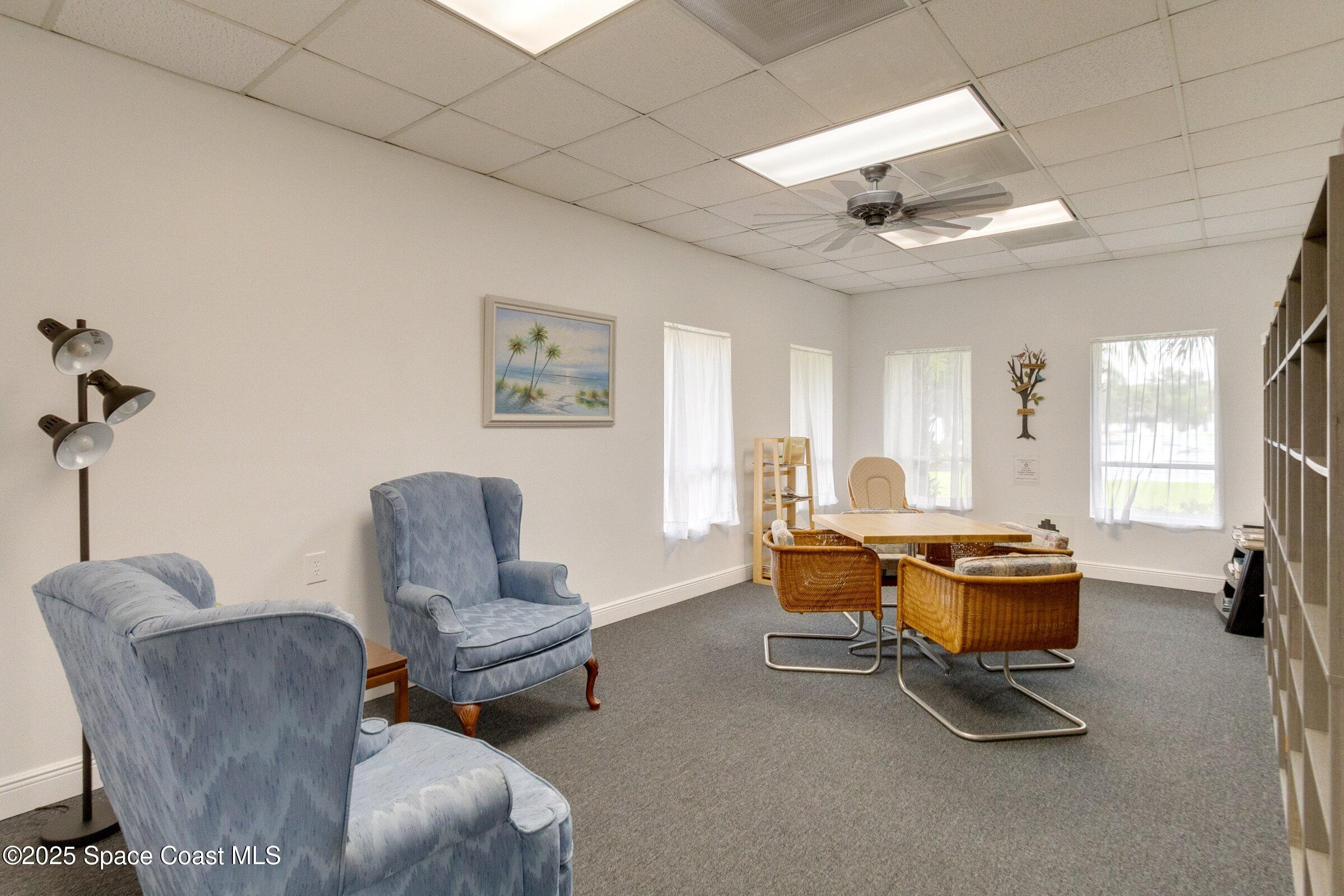 2727 North Wickham Road, Unit 11104 Melbourne, FL 32935 - Photo 41 of 55 a living room with furniture a air conditioner vent and a window