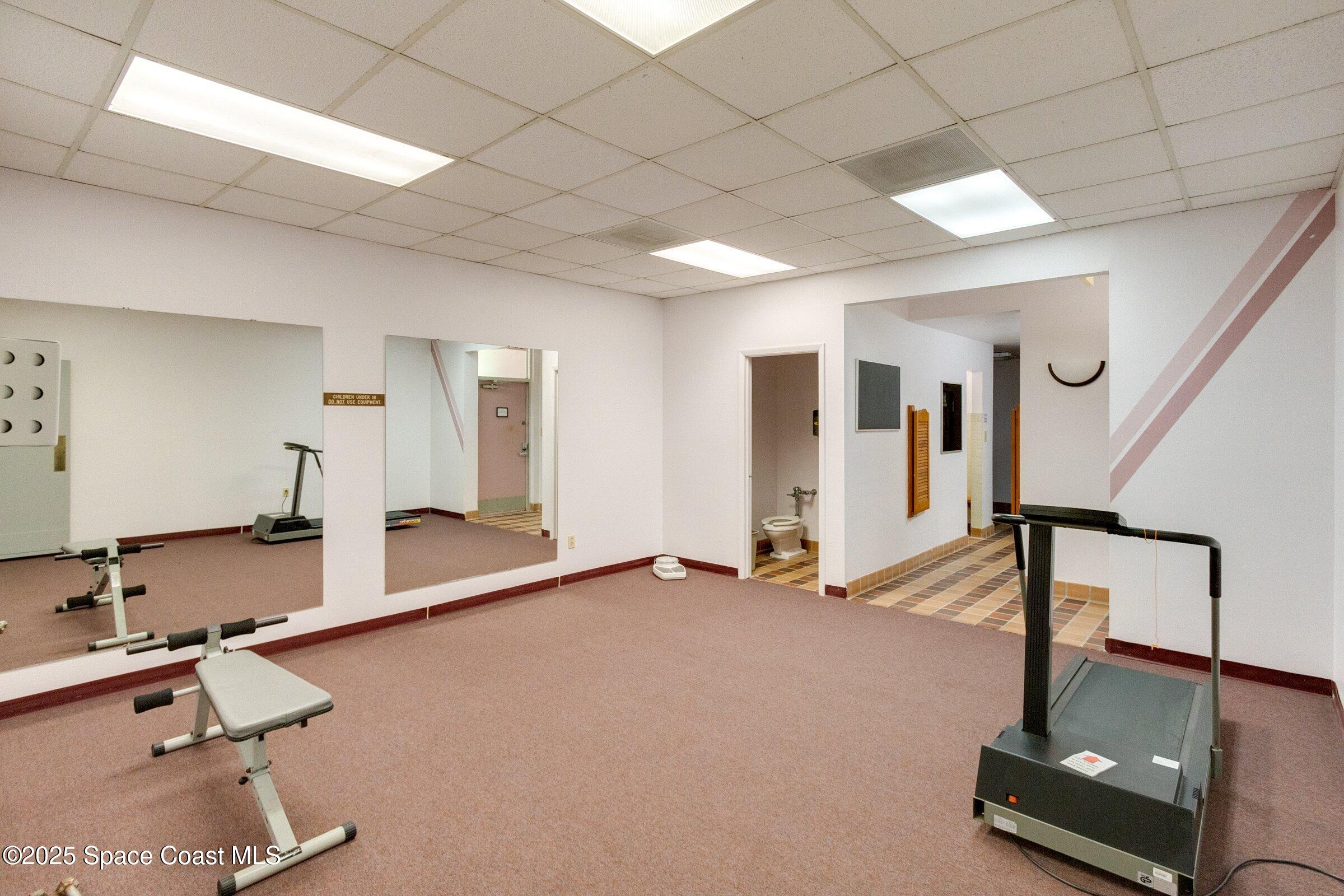 2727 North Wickham Road, Unit 11104 Melbourne, FL 32935 - Photo 42 of 55 a view of a room with gym equipment