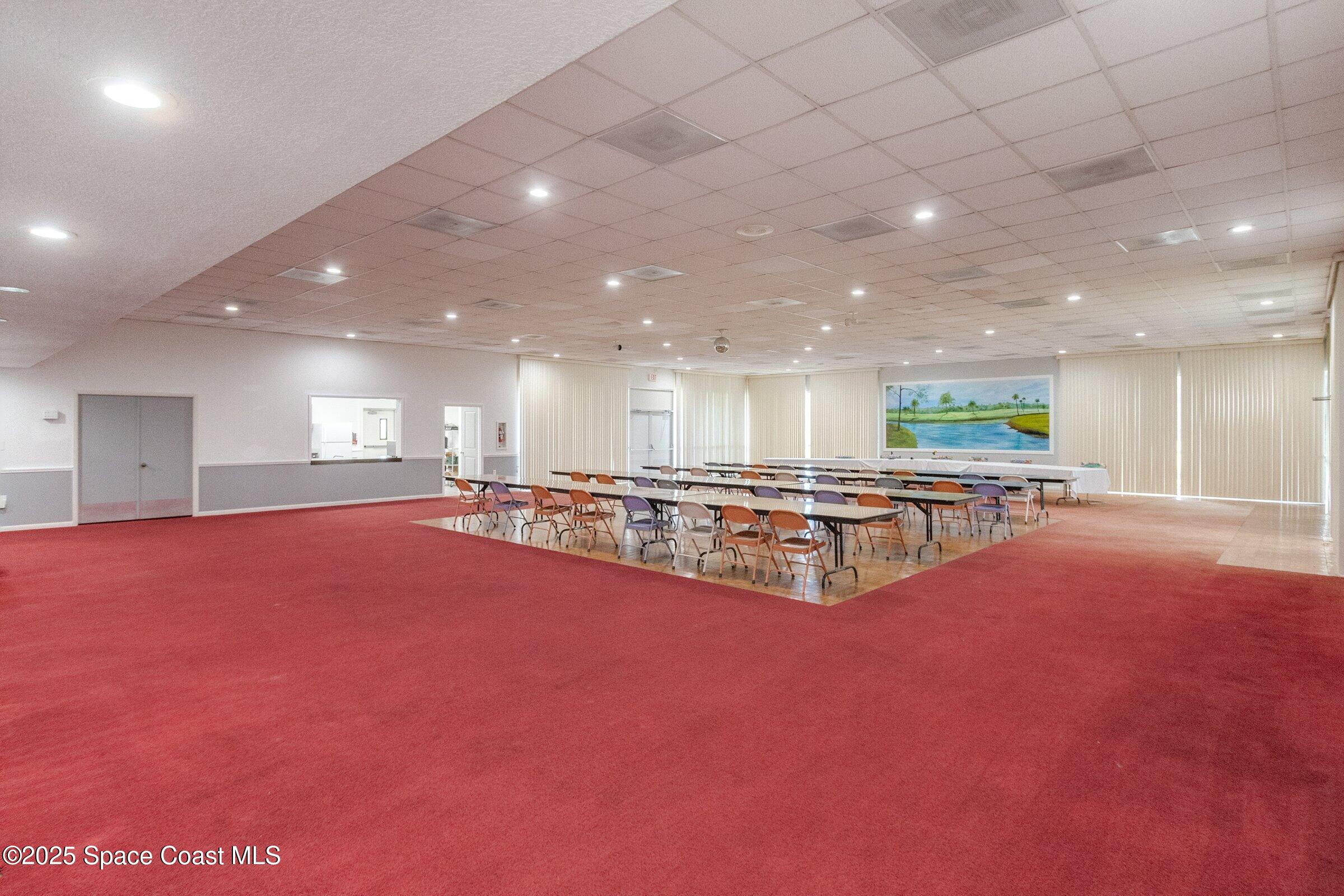 2727 North Wickham Road, Unit 11104 Melbourne, FL 32935 - Photo 44 of 55 a view of an empty room with kitchen and living room