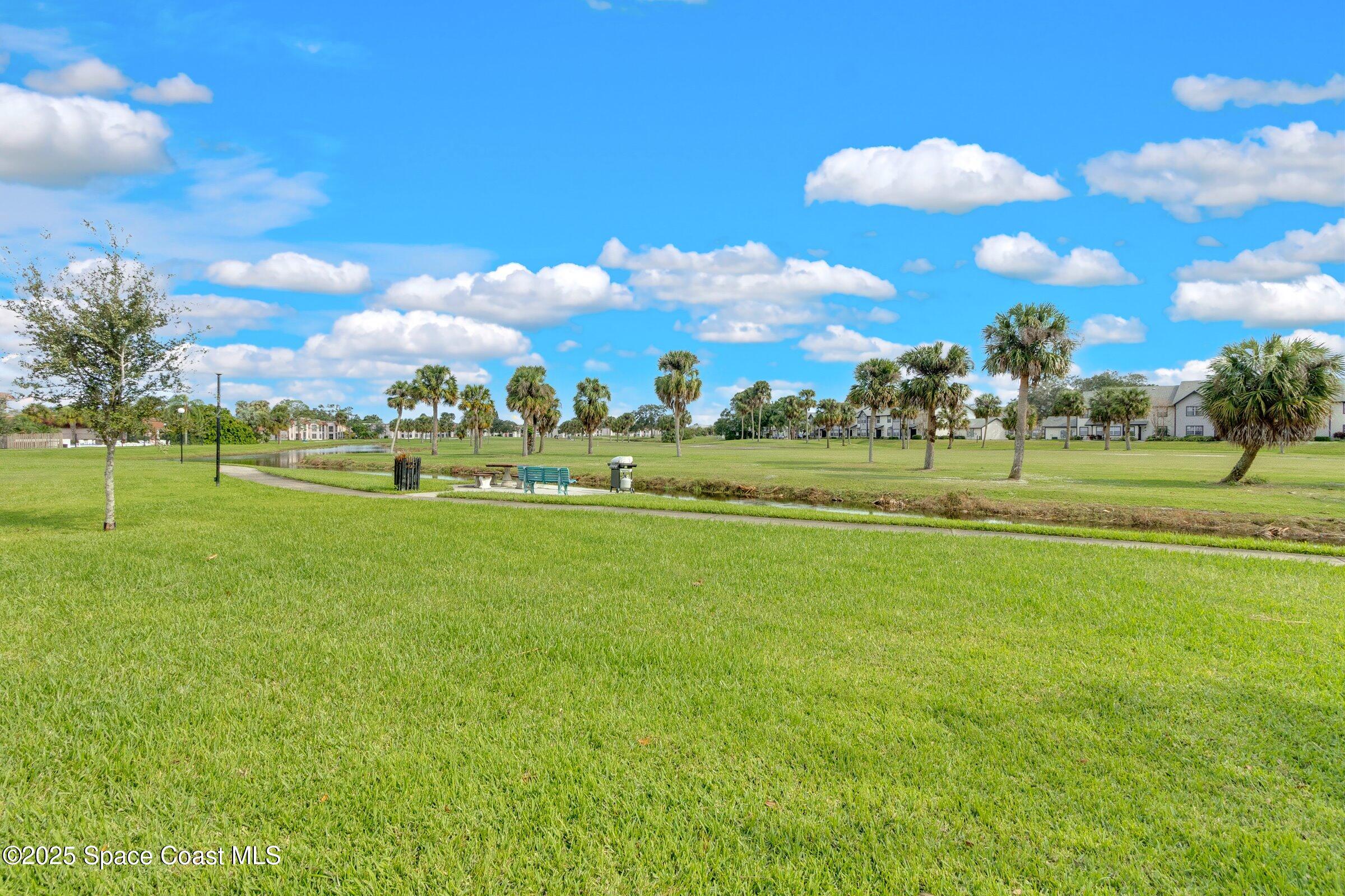 2727 North Wickham Road, Unit 11104 Melbourne, FL 32935 - Photo 51 of 55 a view of a golf course with a lake