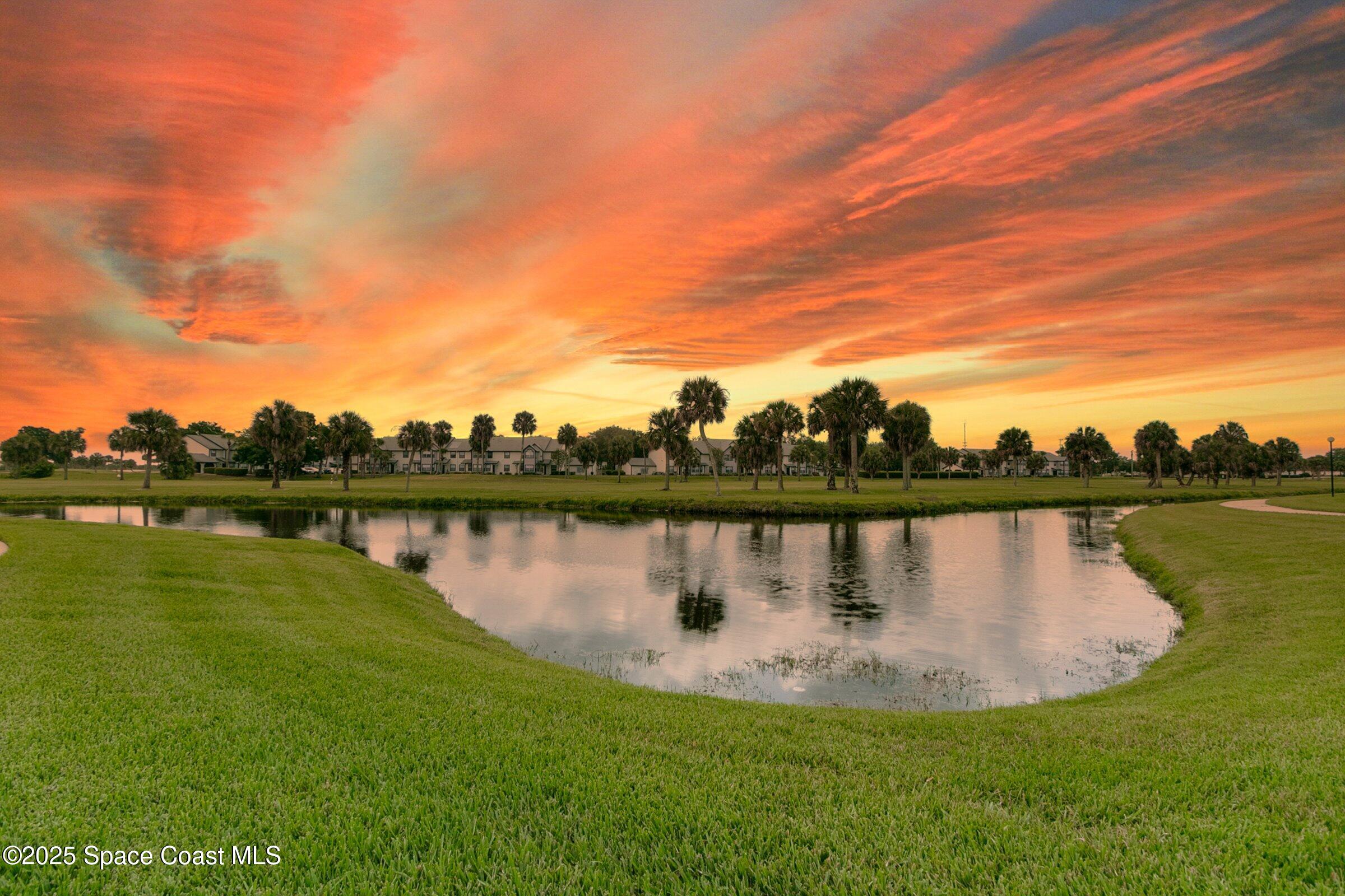 2727 North Wickham Road, Unit 11104 Melbourne, FL 32935 - Photo 53 of 55 a view of a lake with houses