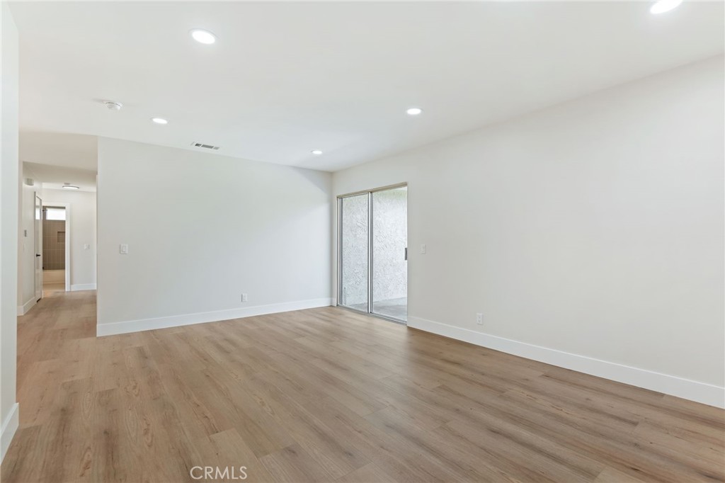 1077 Offshore Street Oxnard, CA 93035 - Photo 13 of 33 a view of an empty room with wooden floor
