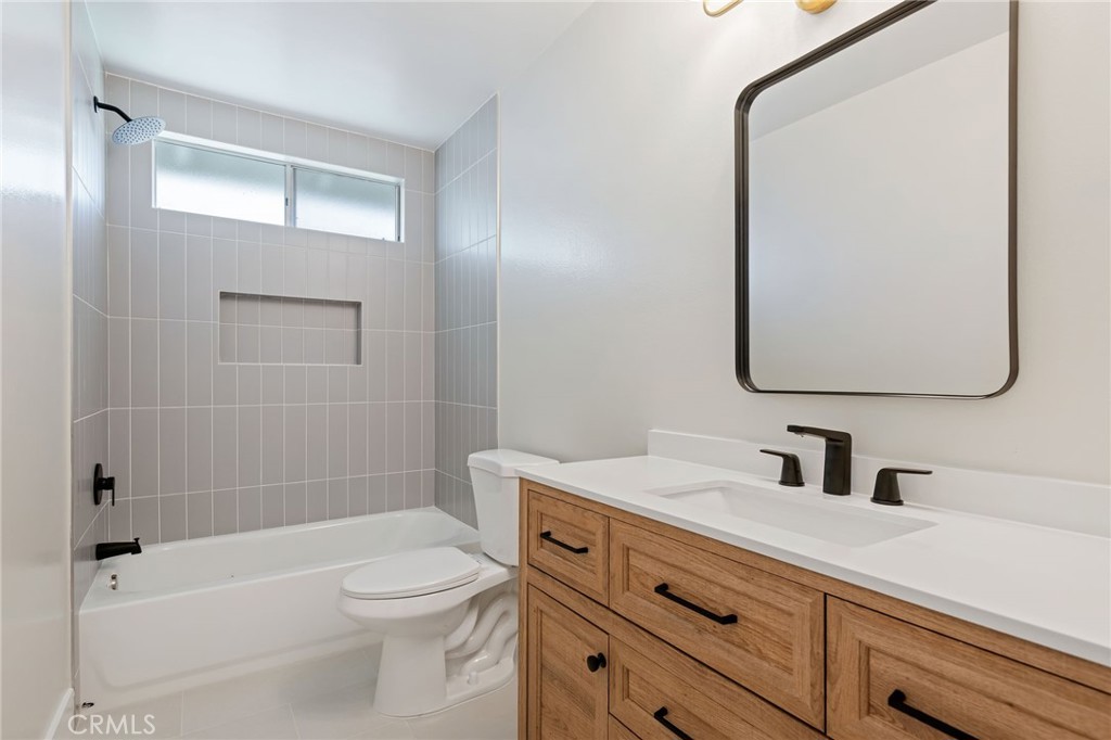 1077 Offshore Street Oxnard, CA 93035 - Photo 20 of 33 a bathroom with a sink a toilet and shower