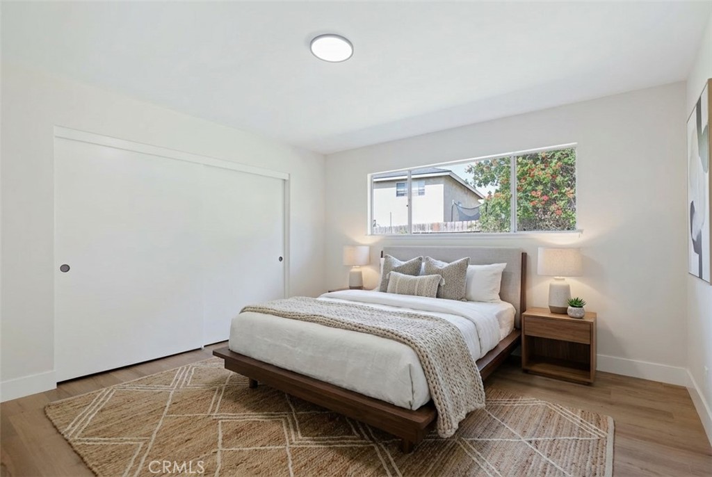 1077 Offshore Street Oxnard, CA 93035 - Photo 22 of 33 a bedroom with a bed and a window