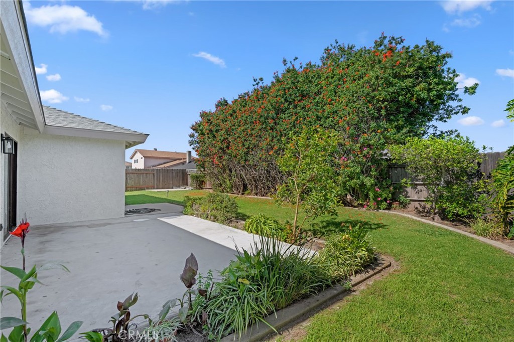 1077 Offshore Street Oxnard, CA 93035 - Photo 33 of 33 a view of a street with potted plants and a large tree