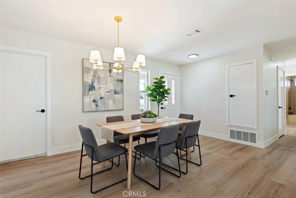 1077 Offshore Street Oxnard, CA 93035 - Photo 6 of 33 a view of a dining room with furniture window and wooden floor