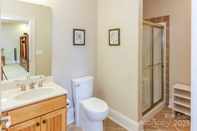 a bedroom with furniture and workout equipment