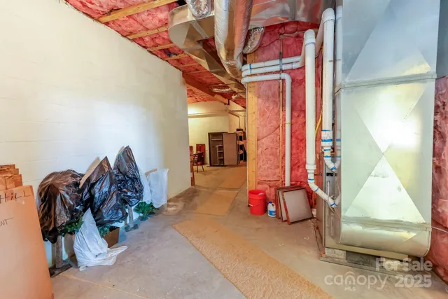 a work room with furniture a desk and chair