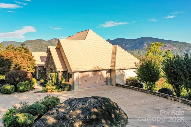 a view of a large trees in front of a house