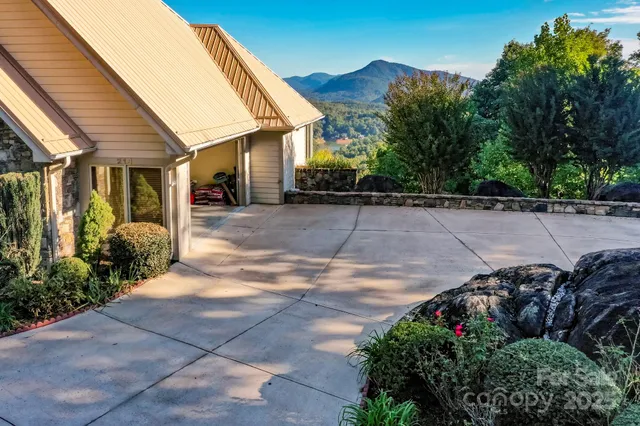 a view of balcony with wooden floor and fence