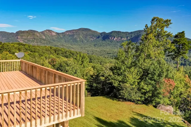 a view of deck with mountain view and wooden floor