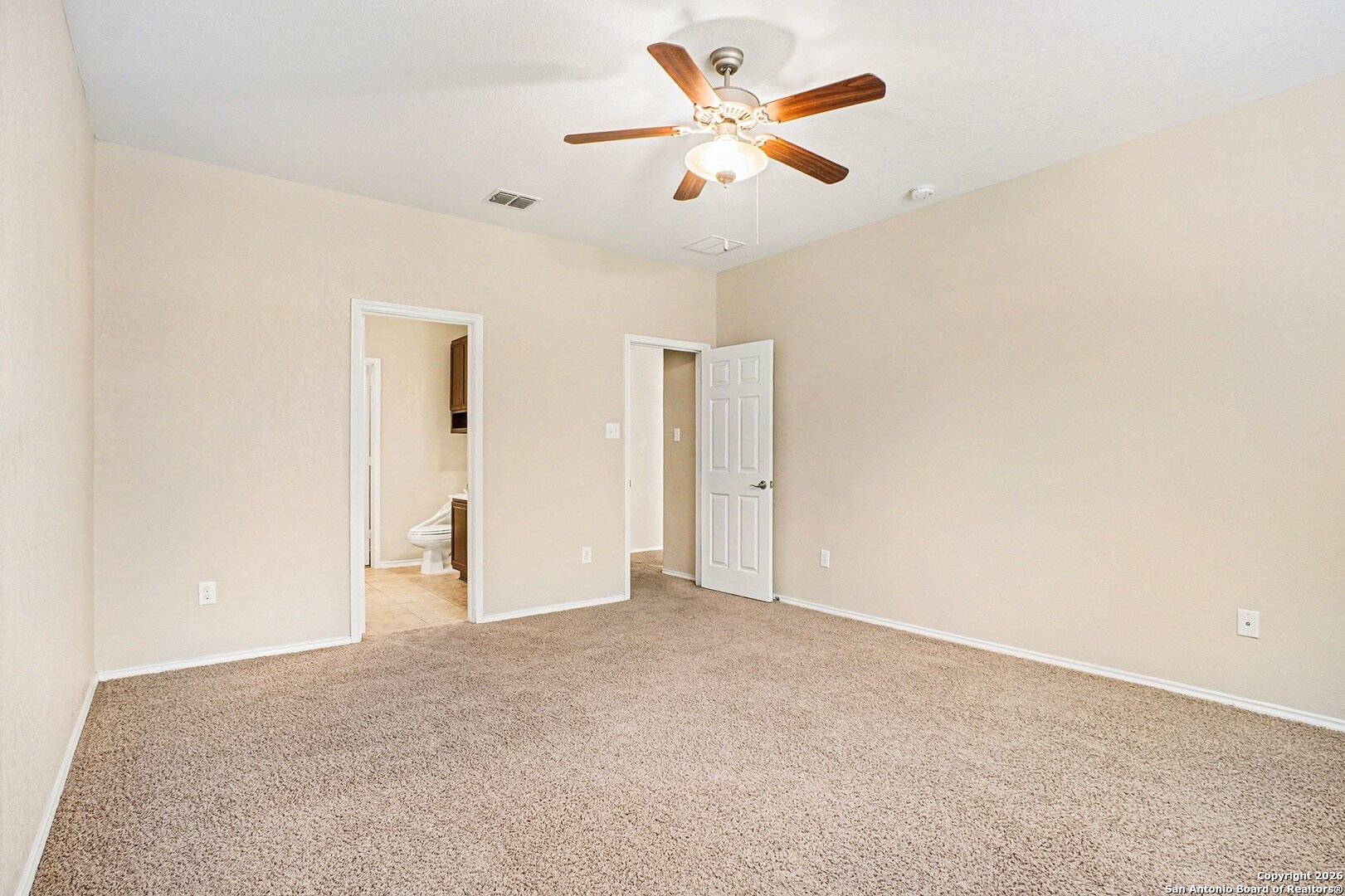 136 Prairie Falcon Boerne, TX 78006 - Photo 12 of 26 an empty room with closet and a ceiling fan