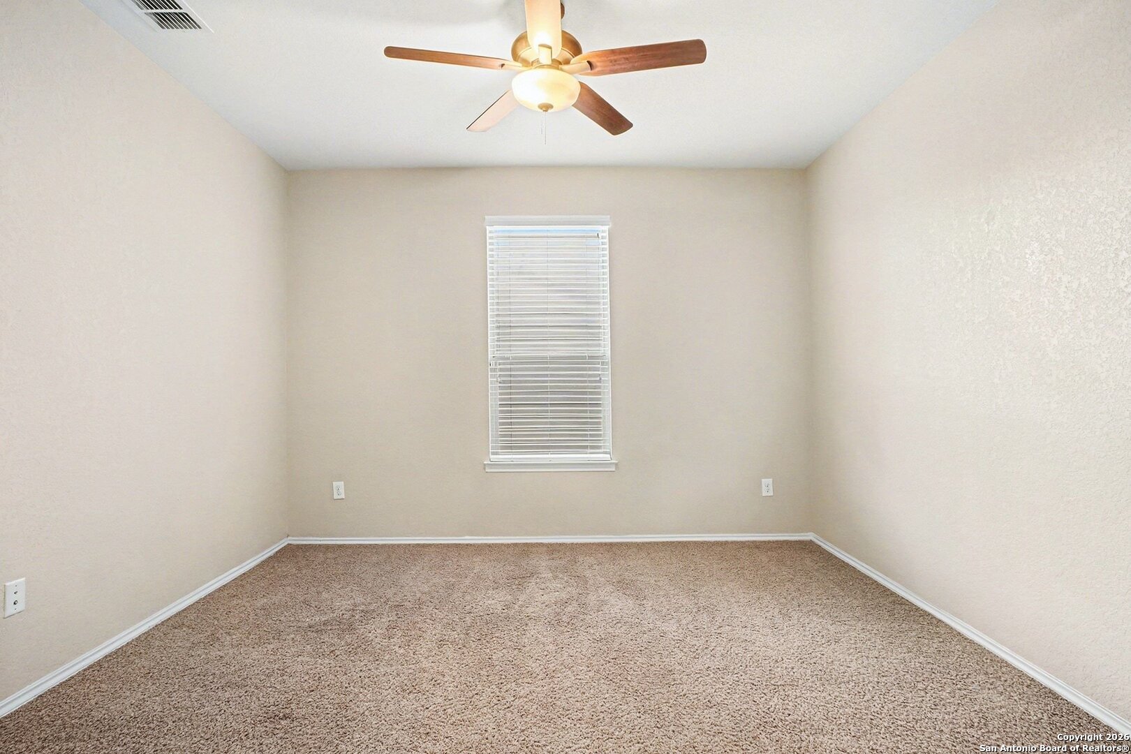 136 Prairie Falcon Boerne, TX 78006 - Photo 16 of 26 an empty room with a window and a fan
