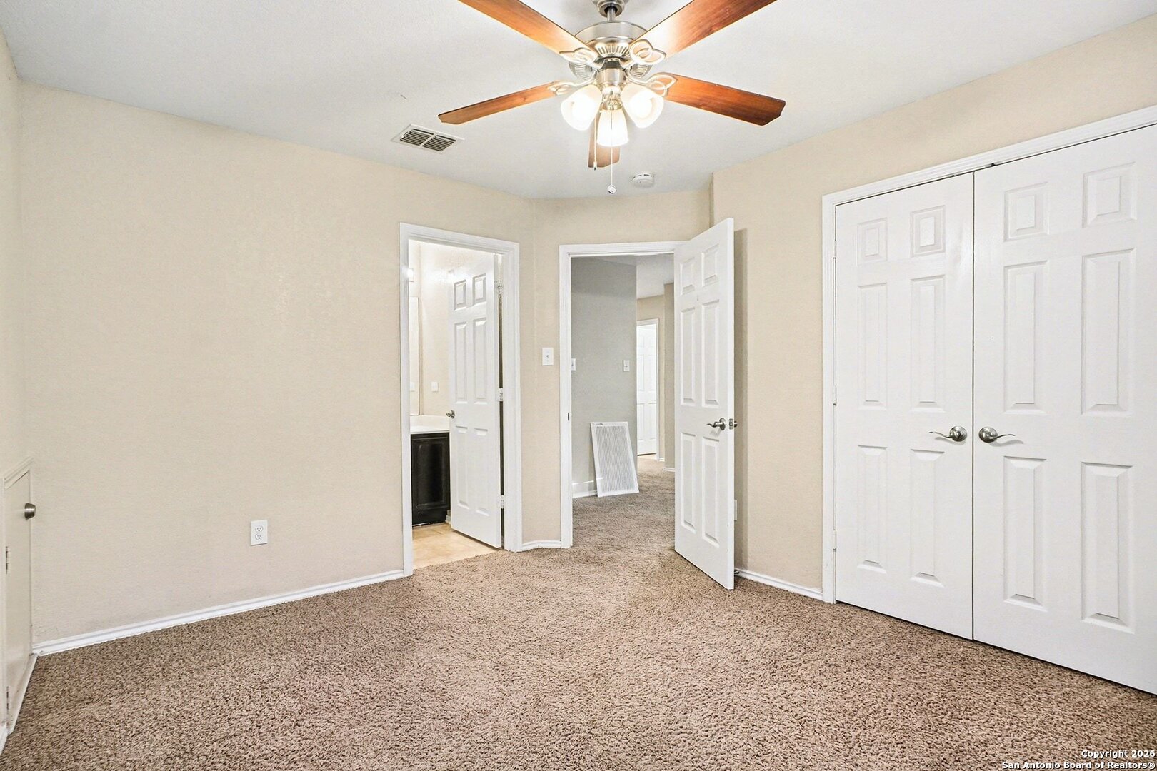 136 Prairie Falcon Boerne, TX 78006 - Photo 17 of 26 an empty room with closet and a chandelier fan