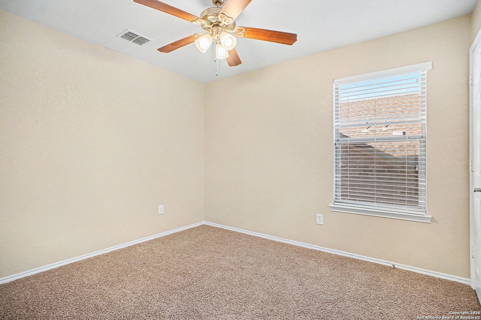 136 Prairie Falcon Boerne, TX 78006 - Photo 22 of 26 an empty room with a window and a fan