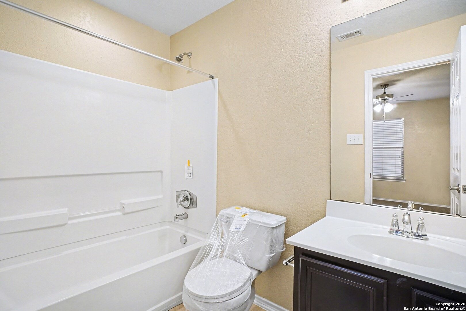 136 Prairie Falcon Boerne, TX 78006 - Photo 23 of 26 a bathroom with a sink toilet vanity and shower