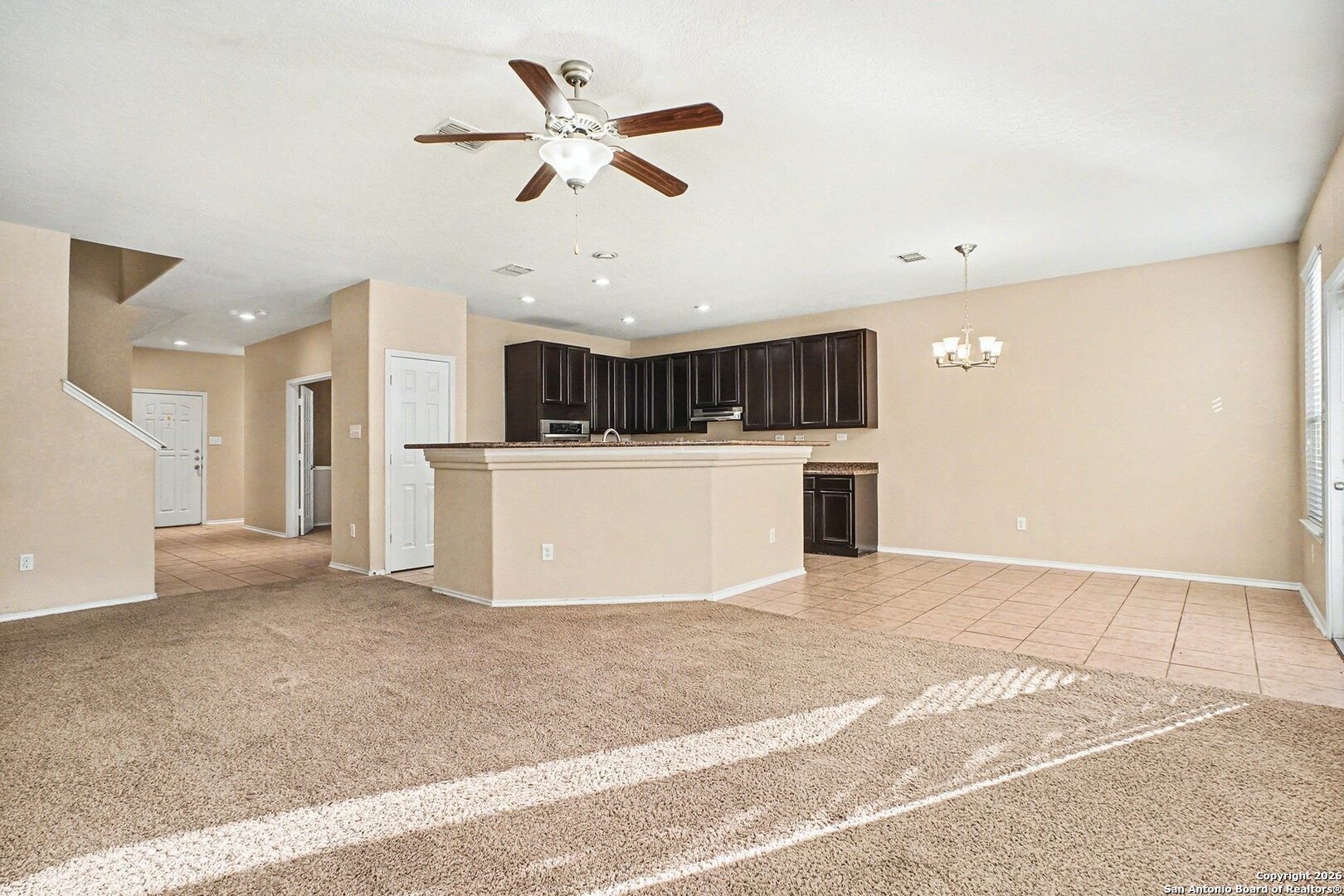 136 Prairie Falcon Boerne, TX 78006 - Photo 4 of 26 a view of a kitchen with a sink and white cabinets