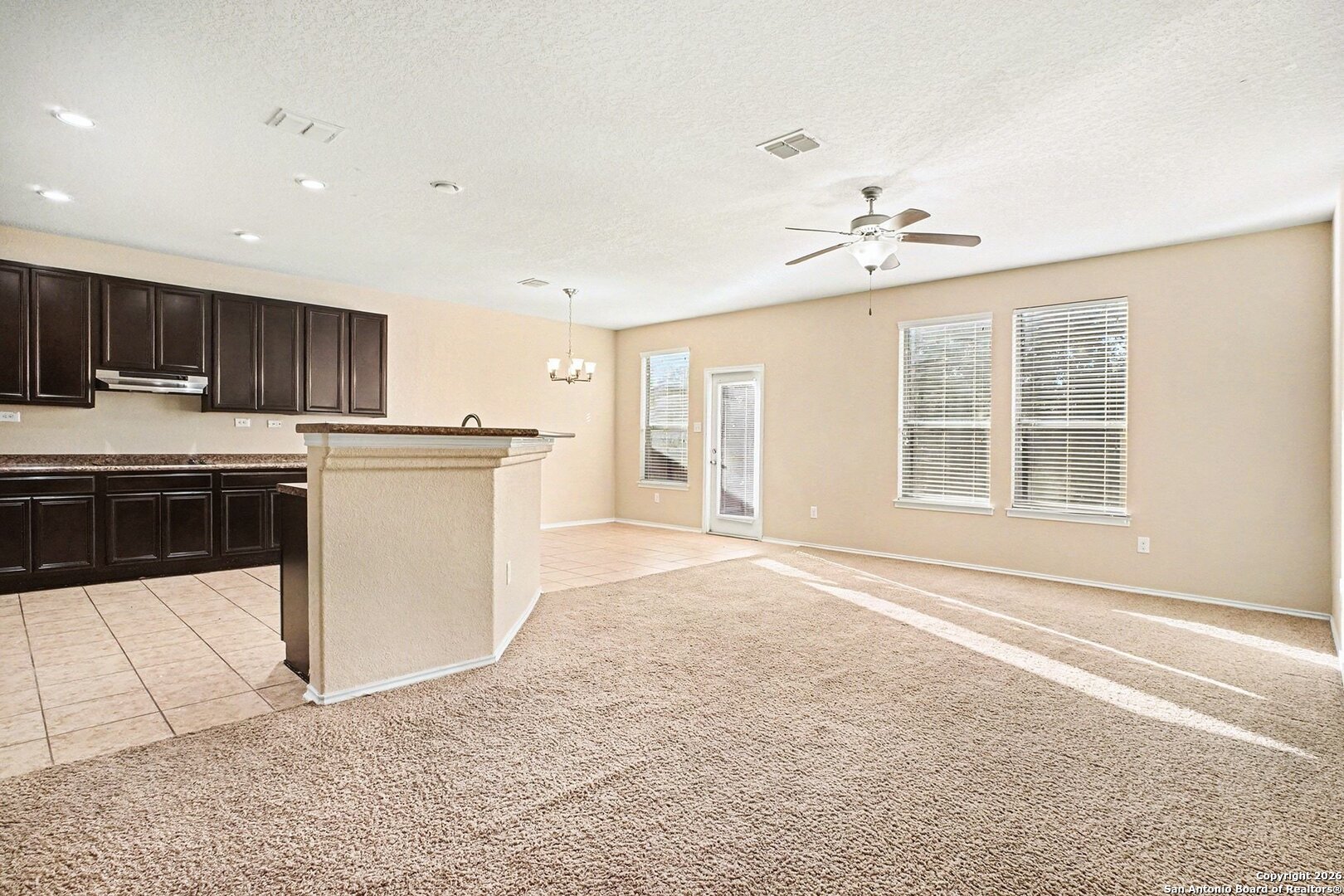 136 Prairie Falcon Boerne, TX 78006 - Photo 5 of 26 a kitchen with a refrigerator and a stove top oven