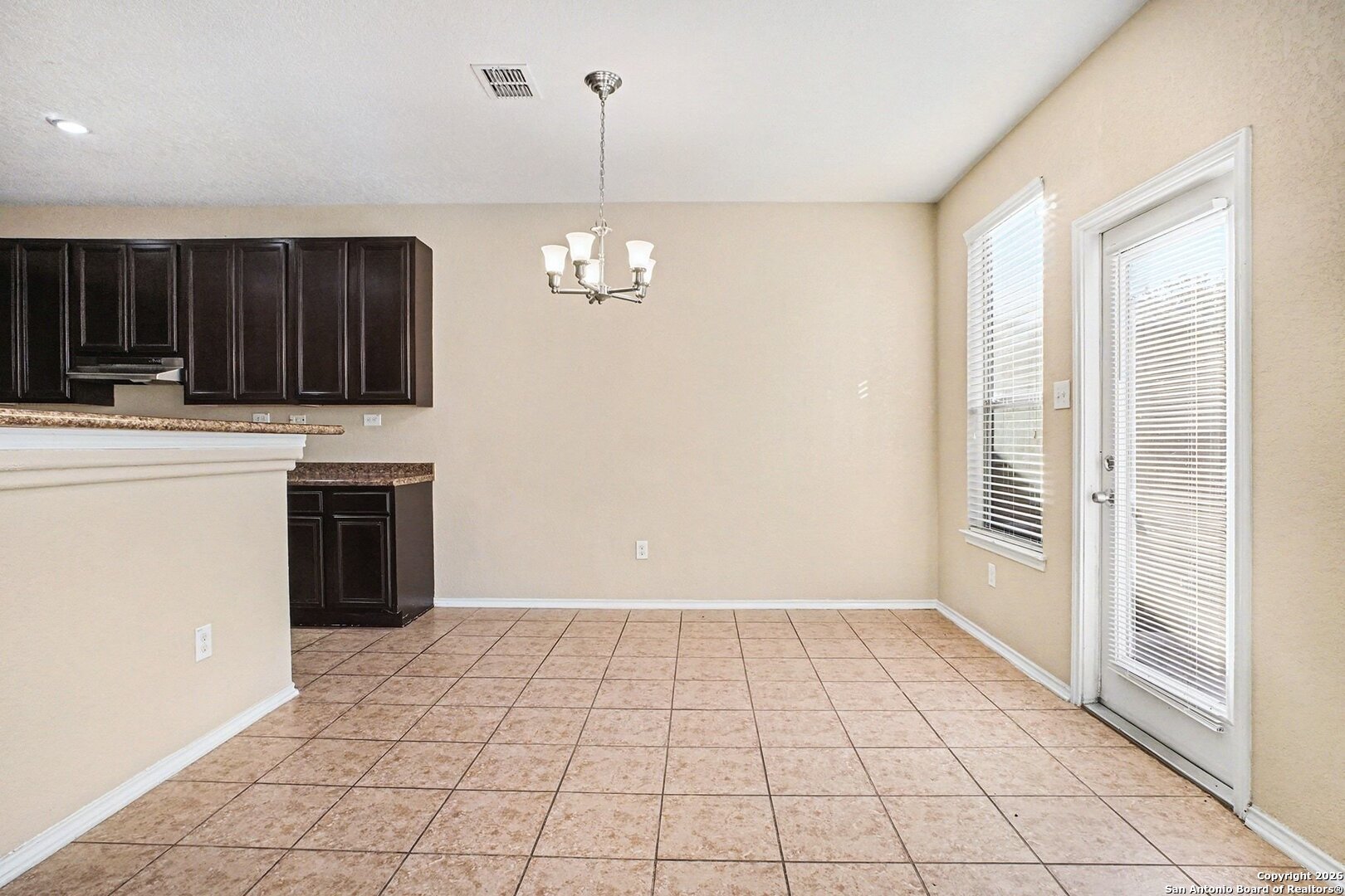 136 Prairie Falcon Boerne, TX 78006 - Photo 9 of 26 a view of a kitchen with a sink and a stove top oven
