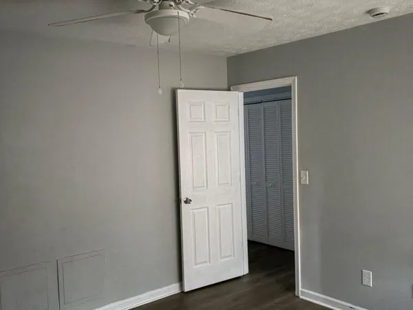 an empty room with wooden floor