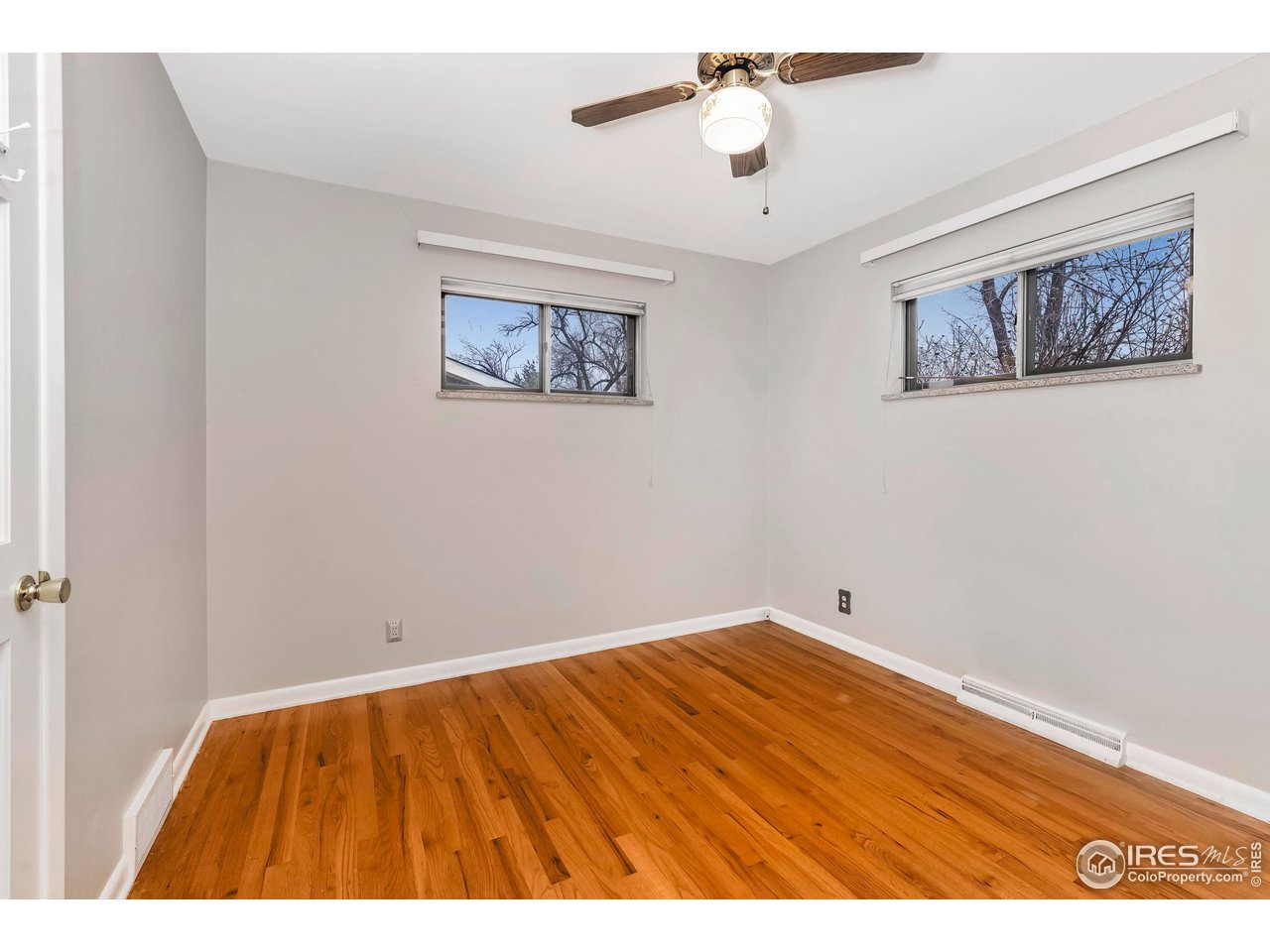 4560 Hanover Avenue Boulder, CO 80305 - Photo 11 of 27 a view of an empty room with a chandelier fan