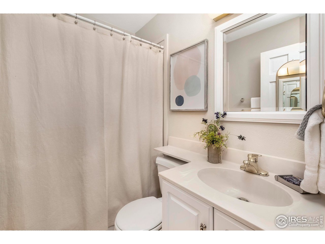 4560 Hanover Avenue Boulder, CO 80305 - Photo 12 of 27 a bathroom with a sink toilet and shower