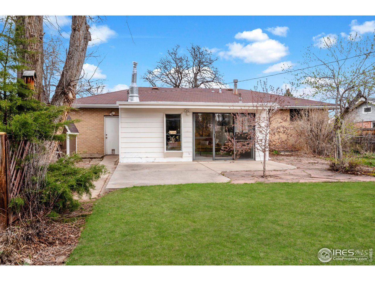 4560 Hanover Avenue Boulder, CO 80305 - Photo 18 of 27 a view of a house with a yard and sitting area