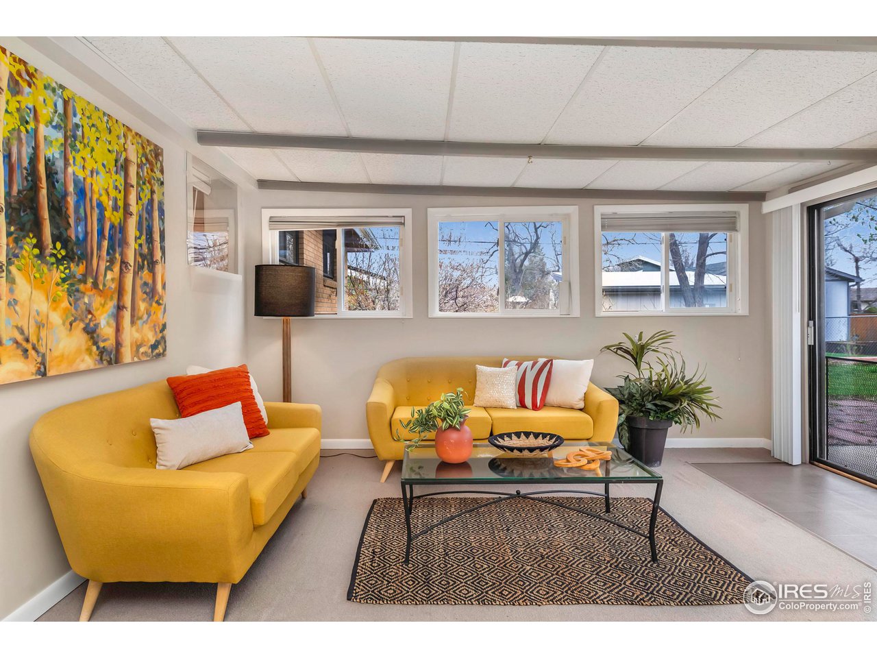 4560 Hanover Avenue Boulder, CO 80305 - Photo 2 of 27 a living room with furniture and a potted plant