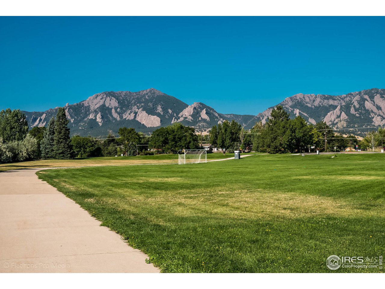 4560 Hanover Avenue Boulder, CO 80305 - Photo 24 of 27 a view of a grassy field with an trees