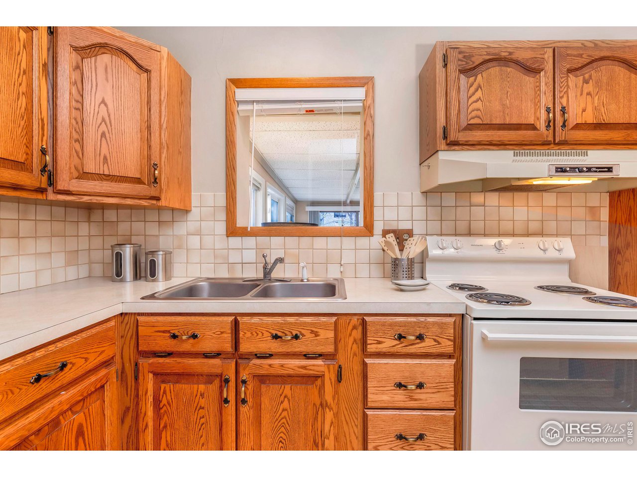 4560 Hanover Avenue Boulder, CO 80305 - Photo 5 of 27 a kitchen with stainless steel appliances granite countertop a sink a stove and cabinets