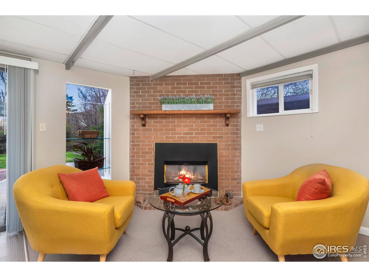 4560 Hanover Avenue Boulder, CO 80305 - Photo 7 of 27 a living room with furniture a fireplace and a window