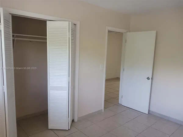 a bathroom with a sink a mirror and shower