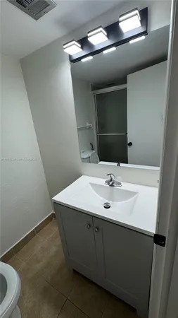 a view of a livingroom and a hallway