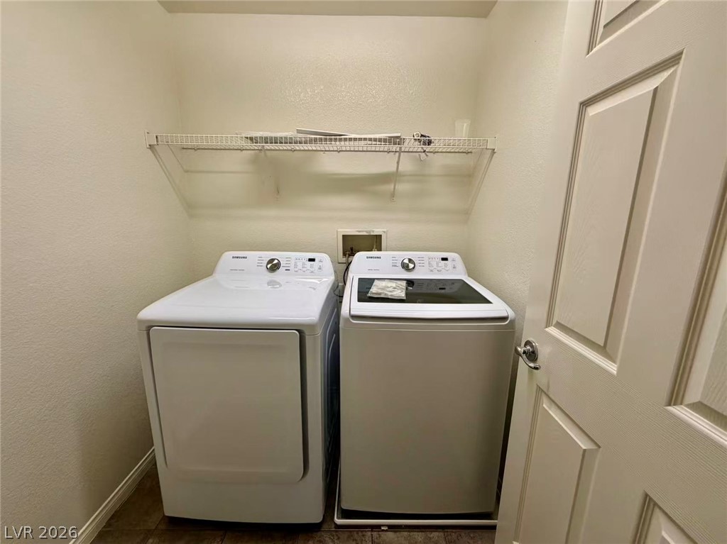 11183 Ranch Valley Street Las Vegas, NV 89179 - Photo 18 of 19 A dedicated laundry space offers convenience with ample room for appliances and storage.