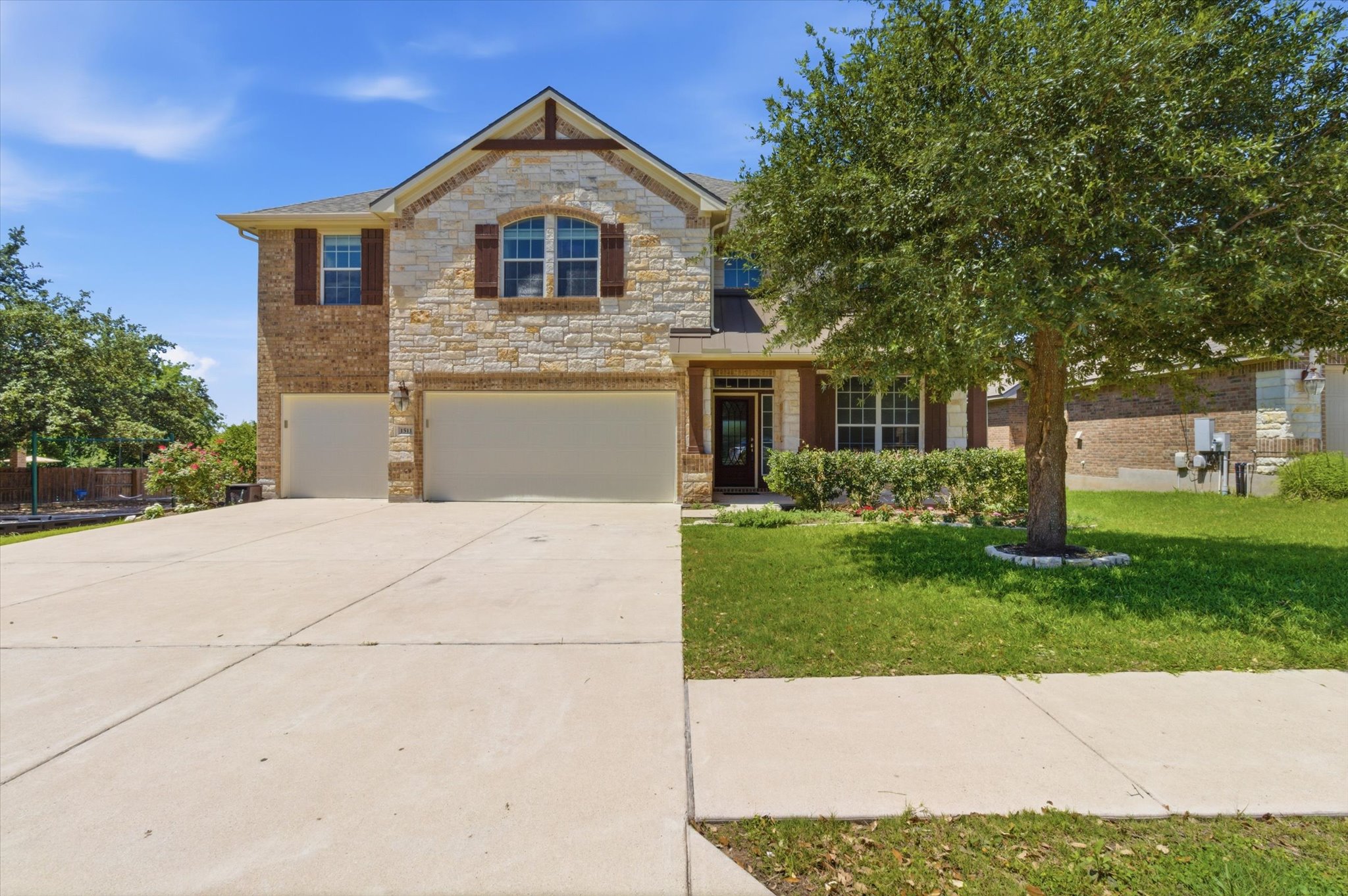 1511 Rimstone Drive Cedar Park, TX 78613 - Photo 2 of 39 A spacious three cars and deep driveway welcomes you to this attractive residence with a mix of brick and stone.