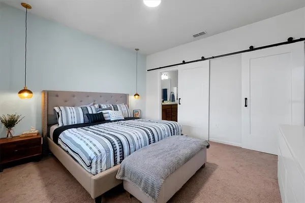 a view of a bed in a bedroom