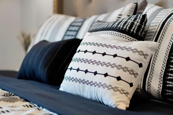 a en suite bathroom with a double vanity sink and a mirror