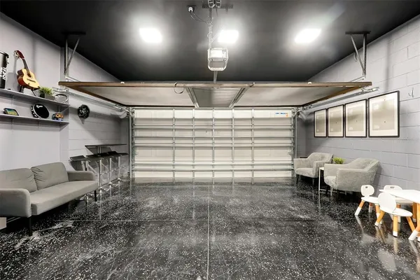 a kitchen with stainless steel appliances kitchen island granite countertop a sink and cabinets