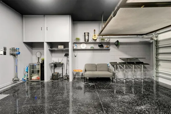 a living room with furniture and a rug