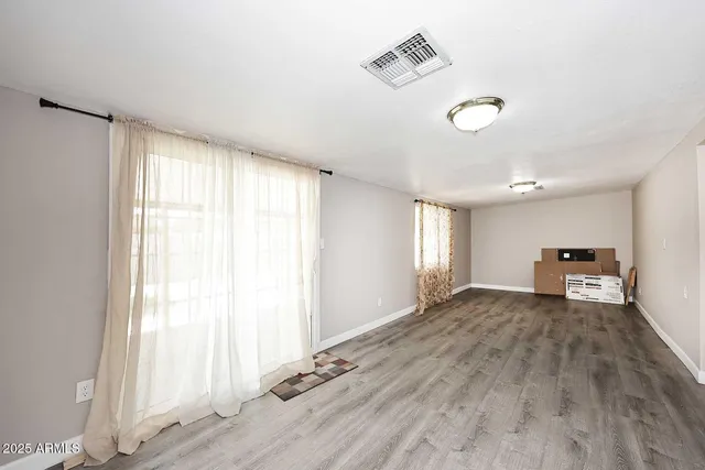 a view of a livingroom with wooden floor