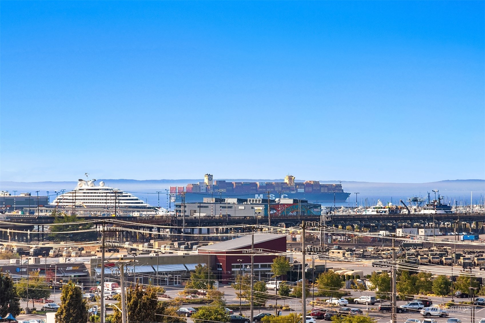 2034 14th Avenue West, Unit 302 Seattle, WA 98119 - Photo 1 of 12 a view of a city with tall buildings