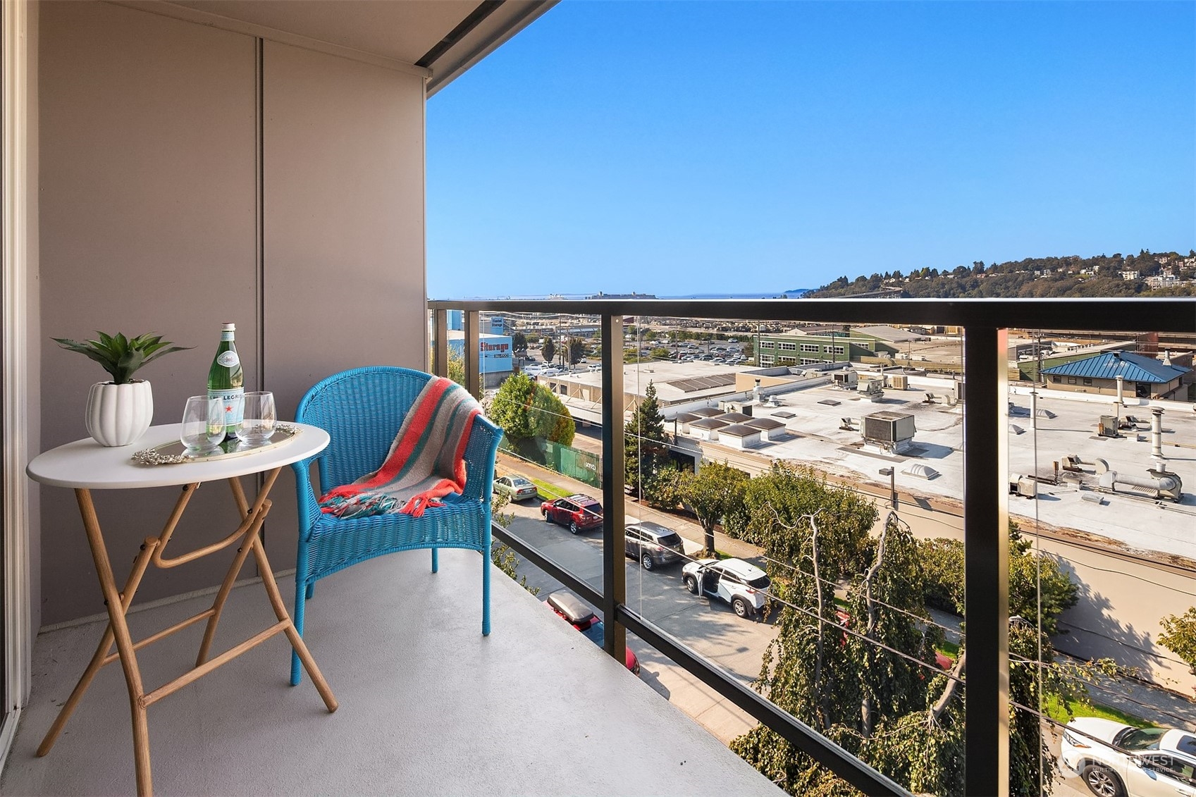 2034 14th Avenue West, Unit 302 Seattle, WA 98119 - Photo 2 of 12 a outdoor dining space with furniture and city view