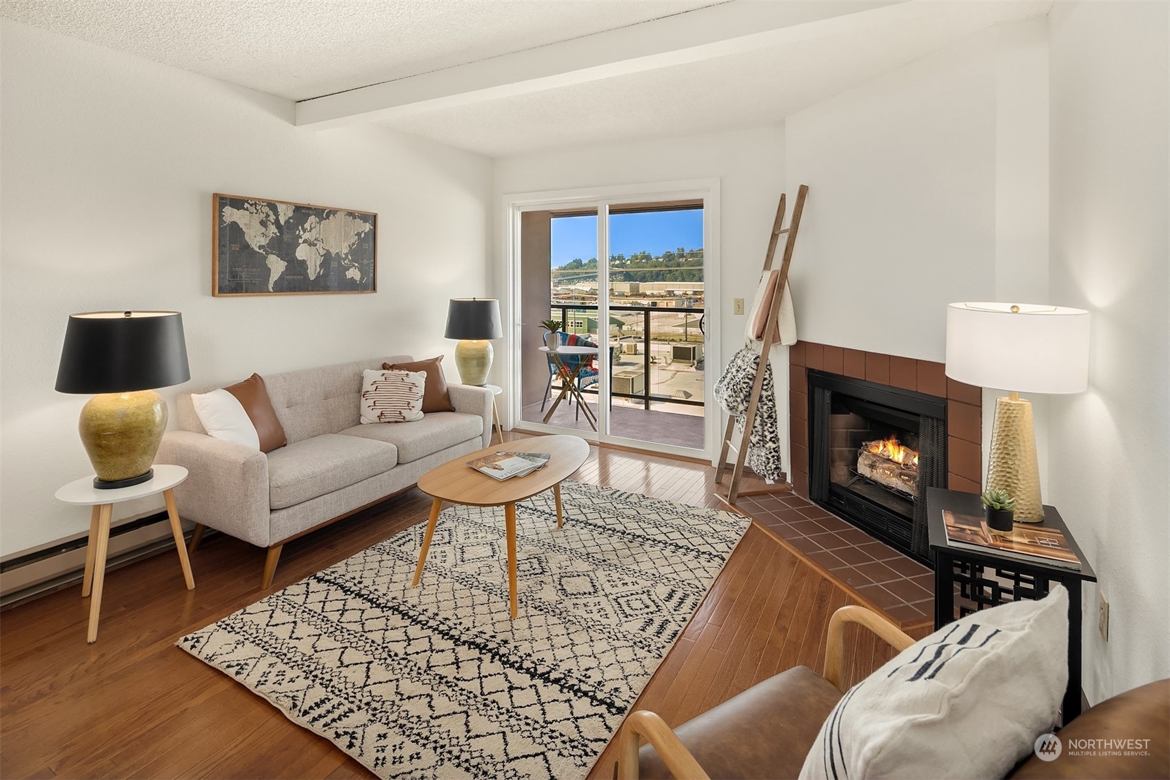2034 14th Avenue West, Unit 302 Seattle, WA 98119 - Photo 3 of 12 a living room with furniture and a fireplace