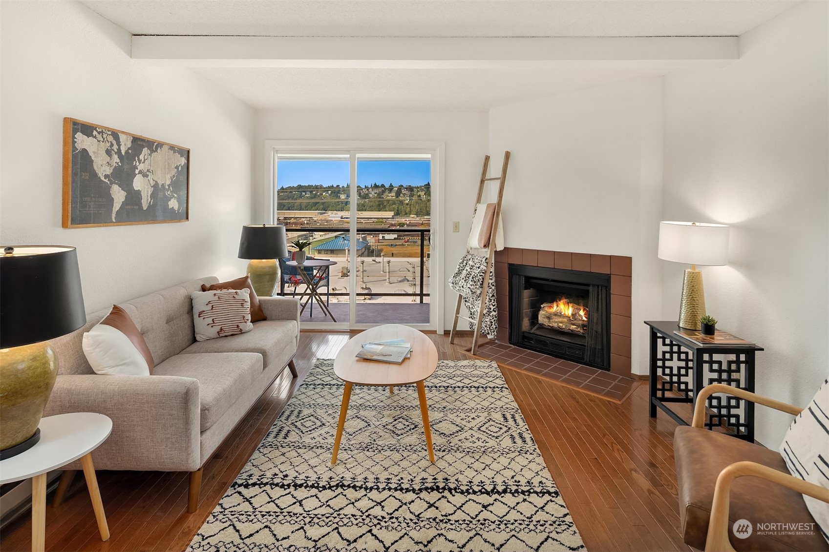 2034 14th Avenue West, Unit 302 Seattle, WA 98119 - Photo 4 of 12 a living room with furniture and a fireplace