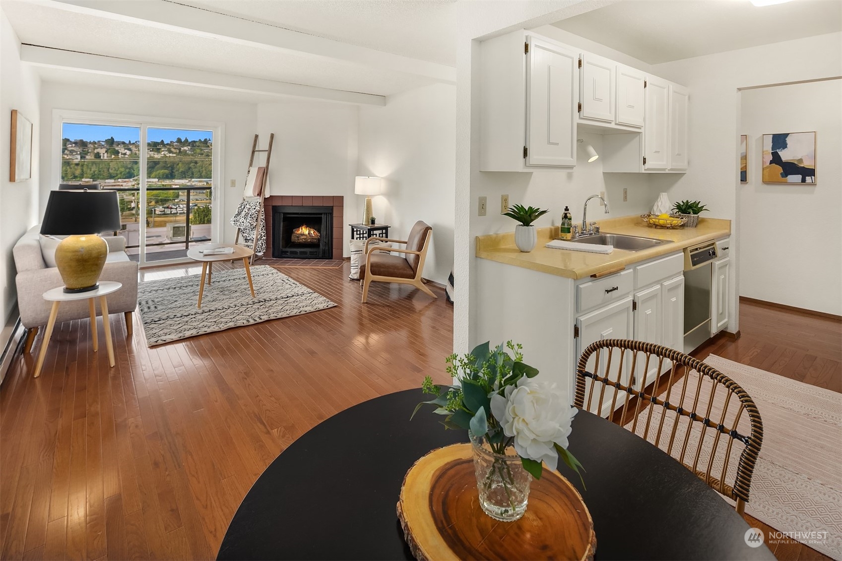 2034 14th Avenue West, Unit 302 Seattle, WA 98119 - Photo 5 of 12 a living room with furniture and a fireplace