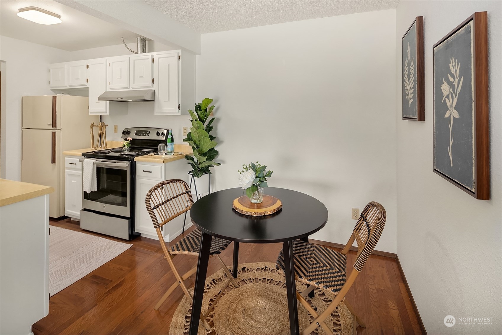 2034 14th Avenue West, Unit 302 Seattle, WA 98119 - Photo 6 of 12 a view of a dining room with furniture