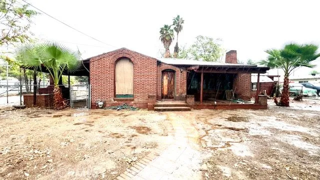 a view of a house with snow on the road