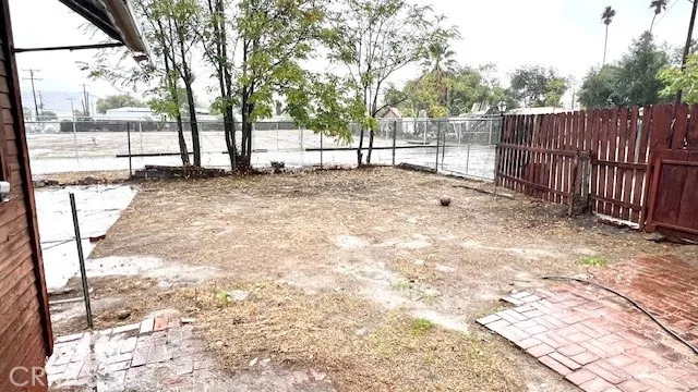 a view of backyard with tree