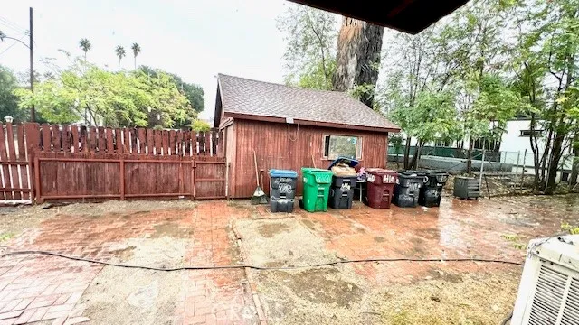 a view of a chairs and tables in the back yard of the house