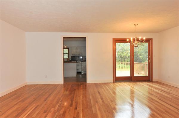 36 Arrowhead Road Concord, MA 01742 - Photo 3 of 14 a view of empty room with wooden floor and fan